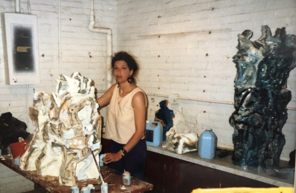 Marcella in a studio in the United States creating a sculpture